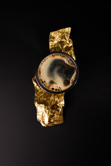 Coffee top view with chocolate on the black table and gold pattern - premium photo