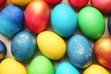 Fototapeta na wymiar Easter eggs on light background, top view