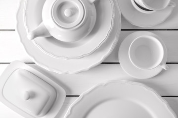 Set of clean dishware on white table