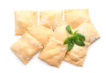 Uncooked ravioli on white background