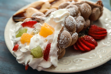 Delicious bubble waffle on plate