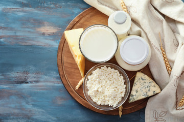 Tasty dairy products on wooden table
