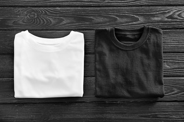 Color t-shirts on wooden background