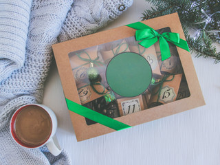 Merry Christmas present advent calendar box.  Decorated with cups of coffee. Place for your text