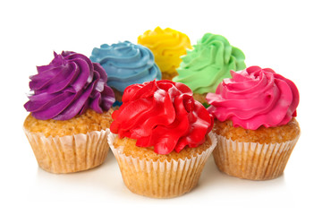 Delicious colorful cupcakes on white background