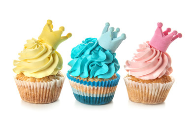 Delicious colorful cupcakes on white background