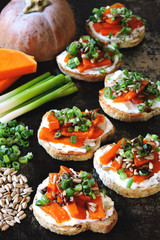 Healthy toasts with pumpkin and green onions. Pumpkin bruschetta