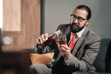Man suffering from nervous breakdown continuing drinking whisky