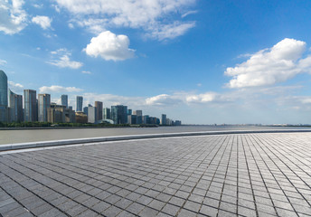 city skyline with empty square in urban