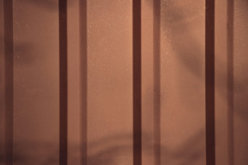Metal background with parallel vertical lines and shadows