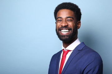 Beautiful black man in front of a colored background