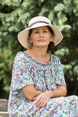 Portrait of a woman in a straw hat