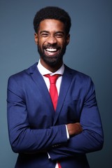 Beautiful black man in front of a colored background