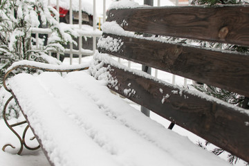 Snowfall. Street shop covered with snow.