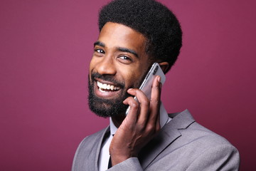 Beautiful black man in front of a colored background