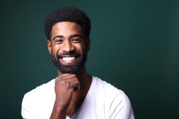 Beautiful black man in front of a colored background
