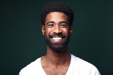Beautiful black man in front of a colored background