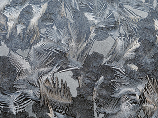 Frosty patterns on the window glass. Beautifully frozen ice