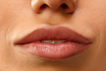 Fototapeta premium Beautiful woman face lips nose closeup beauty skin care concept