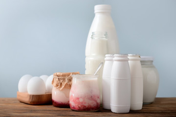 Different milk products on wooden table