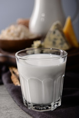 Glass of milk on wooden table