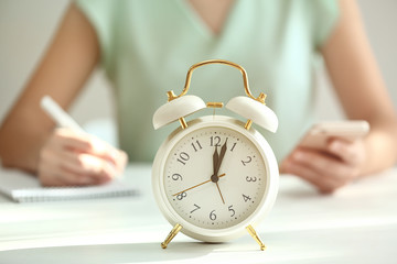 Alarm clock on white table