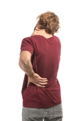 Young man suffering from back pain on white background