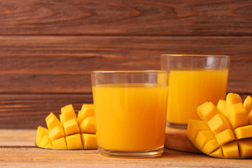 mango juice in a glass and mango fruit.