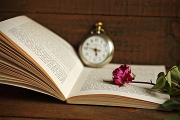 Withered rose and book