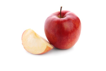 Ripe tasty apple with slice on white background