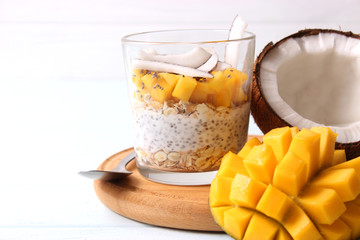 chia pudding with mango, coconut and granola. Proper nutrition, superfood. Healthy breakfast, dessert.