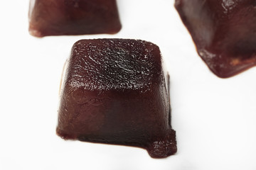 Coffee ice cubes on white background
