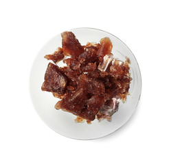 Plate with crushed coffee ice on white background