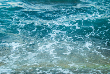 Abstract blue background of frothy sea surface.