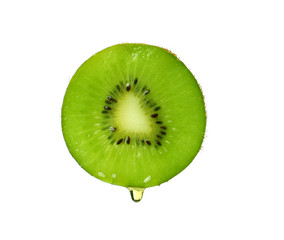 Essential oil dripping from kiwi slice on white background