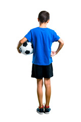 A full-length shot of Boy playing soccer on isolated white background