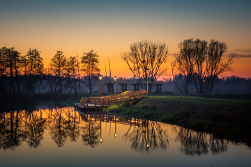 Fototapeta na wymiar Sunset over the bridge in Konstancin Jeziorna, Masovia, Poland