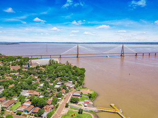 Aerial view of Encarnacion in Paraguay overlooking the bridge to Posadas in Argentina.