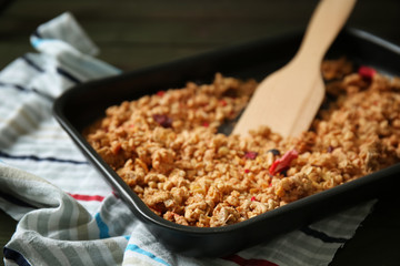 Tasty granola on baking tray