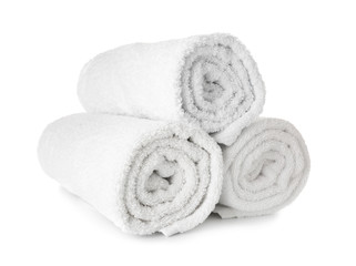 Fototapeta na wymiar Clean rolled towels on white background