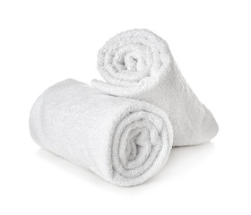 Clean rolled towels on white background