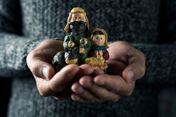 the holy family in the hands of a man