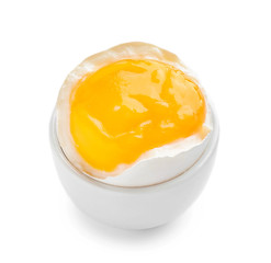 Tasty soft boiled egg in holder on white background