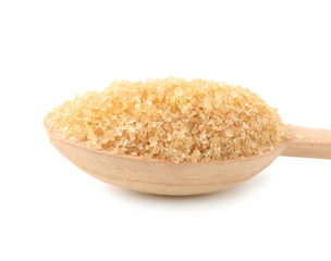 Granulated brown sugar in wooden spoon on white background