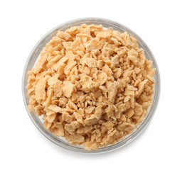 Bowl with maple sugar flakes on white background