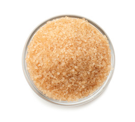 Granulated brown sugar in bowl on white background