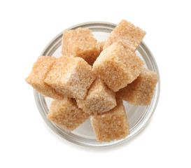 Bowl with brown cane sugar cubes on white background