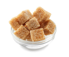 Bowl with brown cane sugar cubes on white background