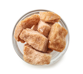Bowl with rock sugar on white background