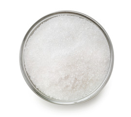 Bowl with sugar on white background